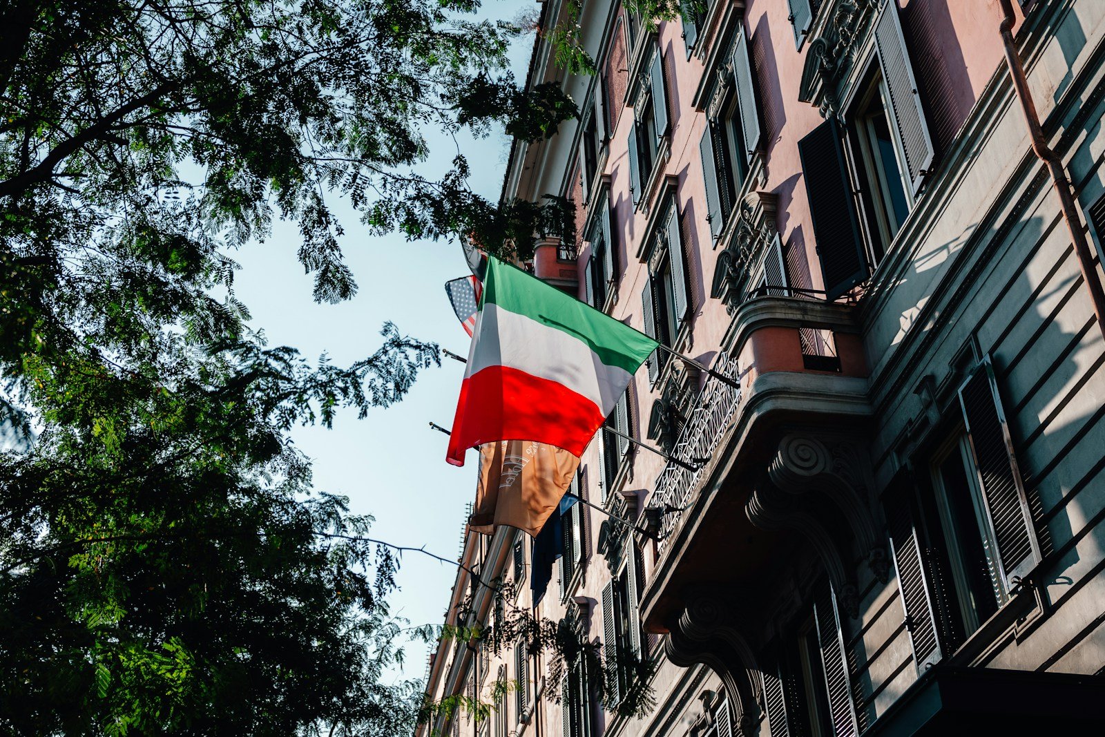 A building with a flag hanging off of it's side